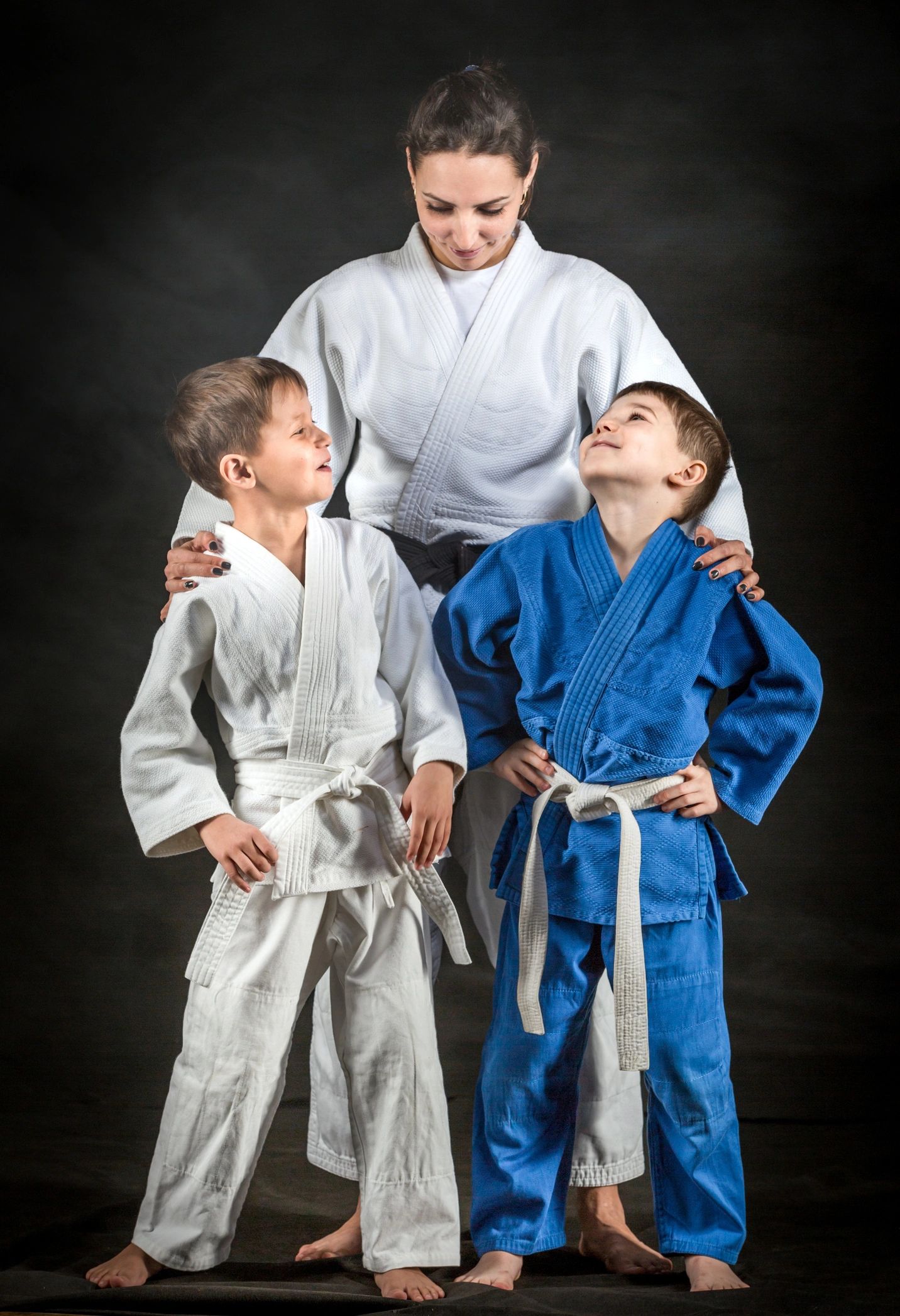 Judo coach with young students